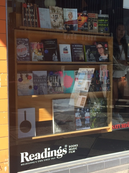 Book in front shop window sideways